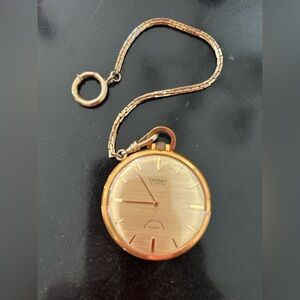 Classic Crosby pocket watch featuring 17-jewel movement and a gold-tone finish